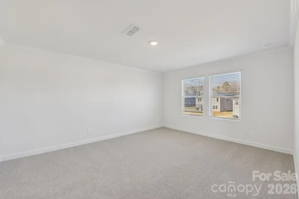 an empty room with a empty space and window