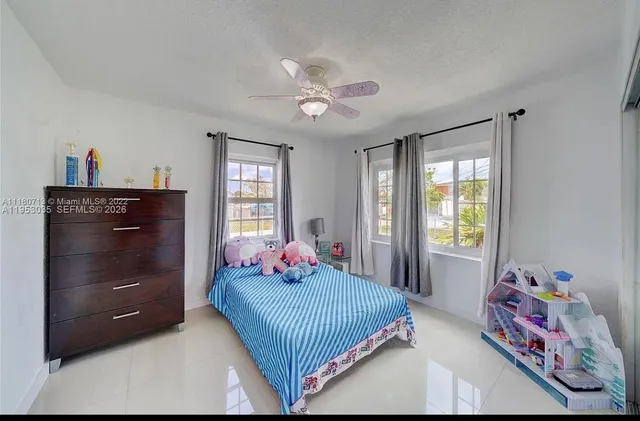 a room with furniture and a flat screen tv