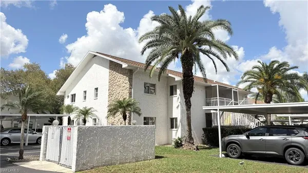 a view of a car parked in front of a house