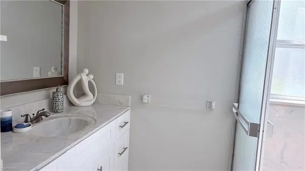 a bathroom with a sink and mirror