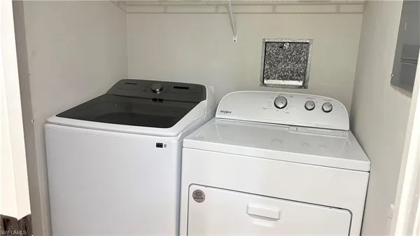 a utility room with dryer and washer