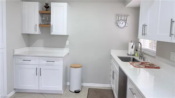 a kitchen with a sink and cabinets