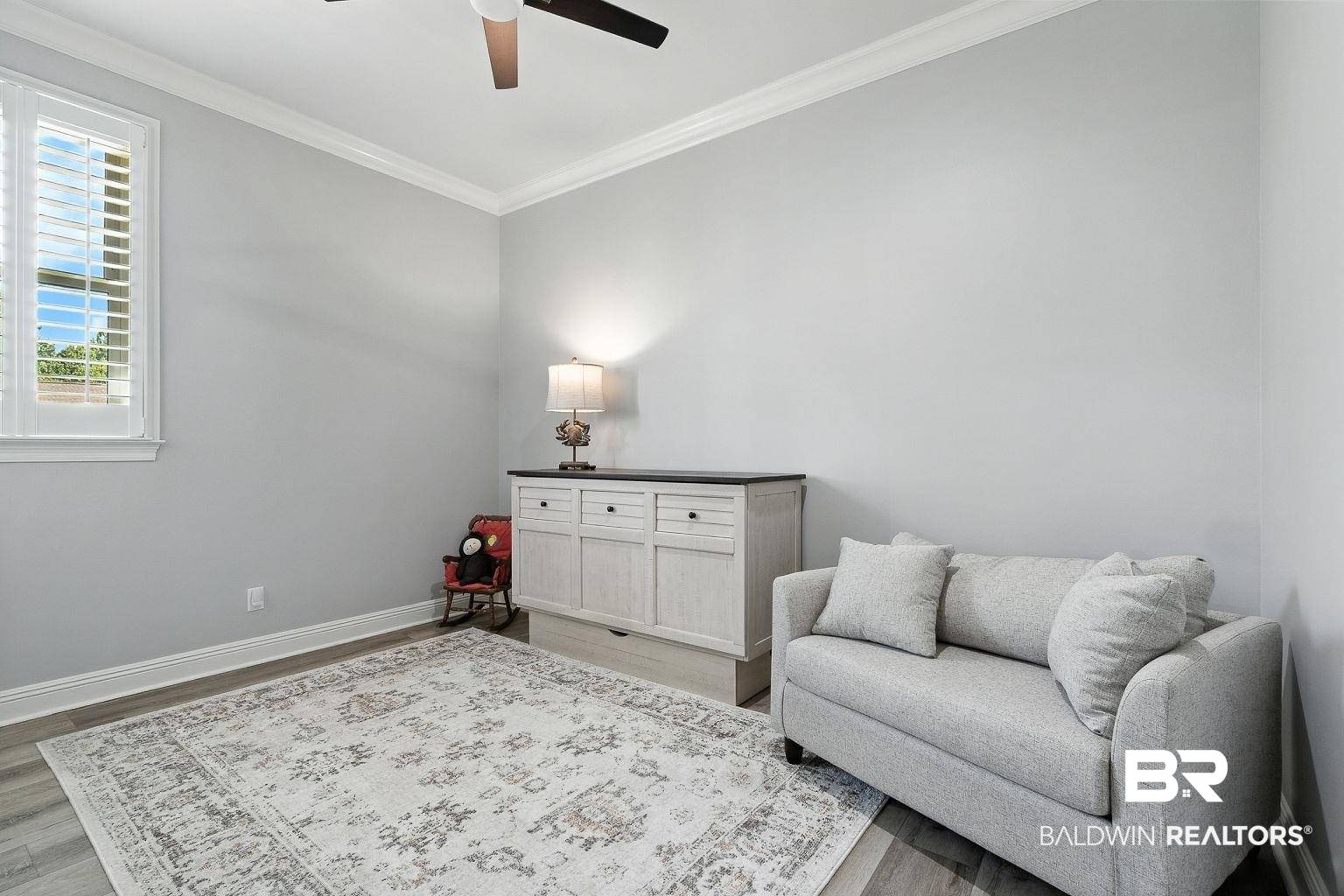 23357 Carnoustie Drive Foley, AL 36535 - Photo 68 of 99 Sitting room with crown molding, wood finished floors, and ceiling fan