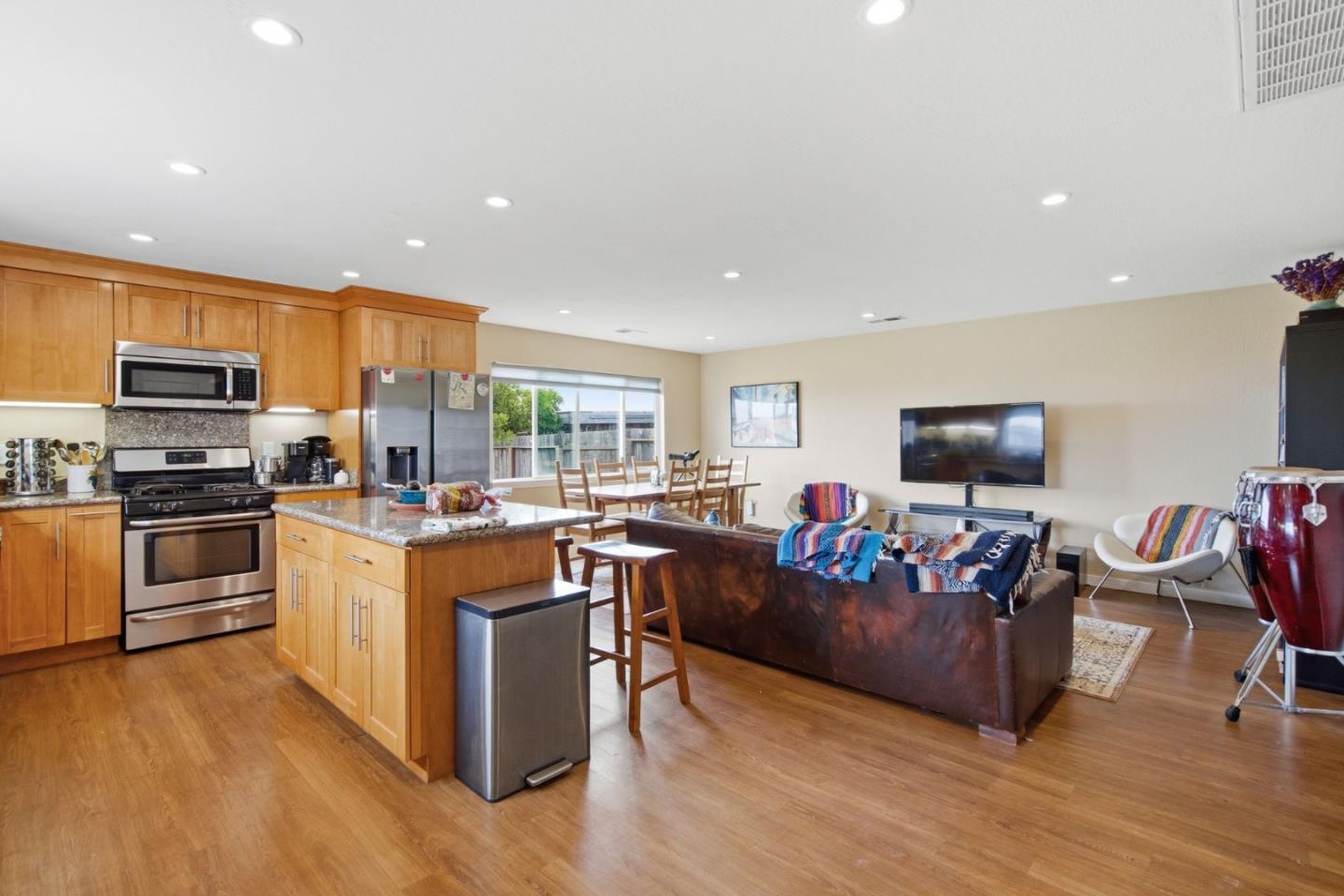 1263 Reservoir Road Pescadero, CA 94060 - Photo 48 of 66 a living room with stainless steel appliances furniture and a flat screen tv