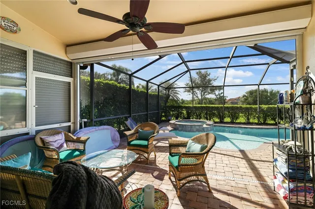 a view of swimming pool with outdoor seating and a yard
