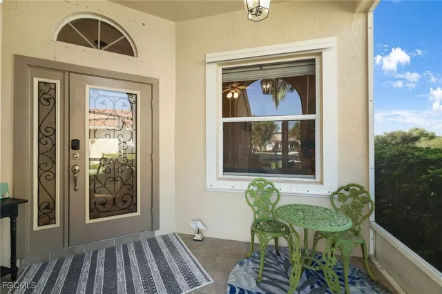 a view of a door and chair in the balcony