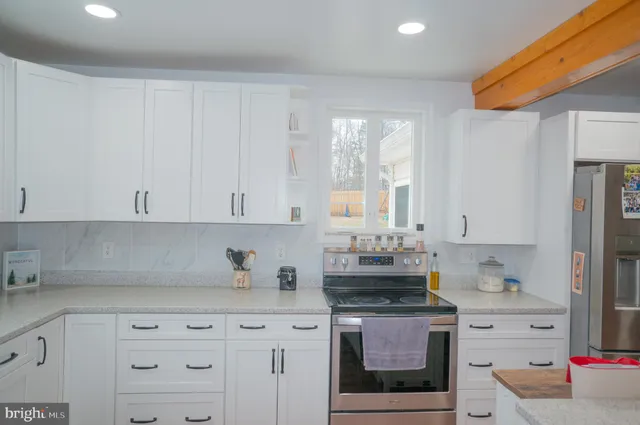 a bathroom with a double vanity sink a mirror and a shower