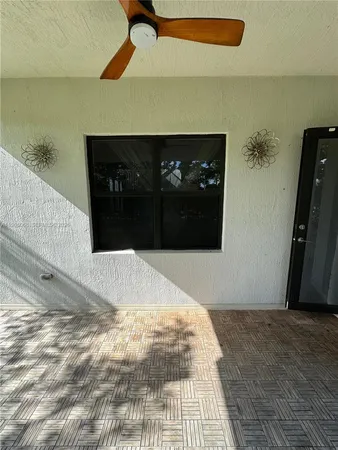 a view of a porch and garden