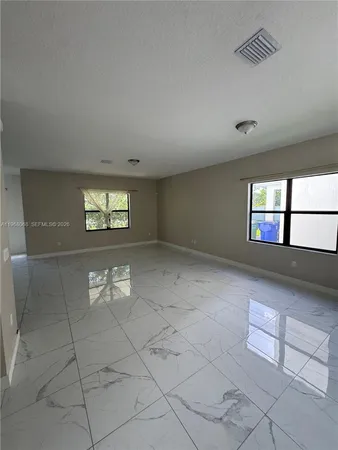 a view of a livingroom and window