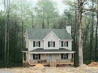 a aerial view of a house with a yard