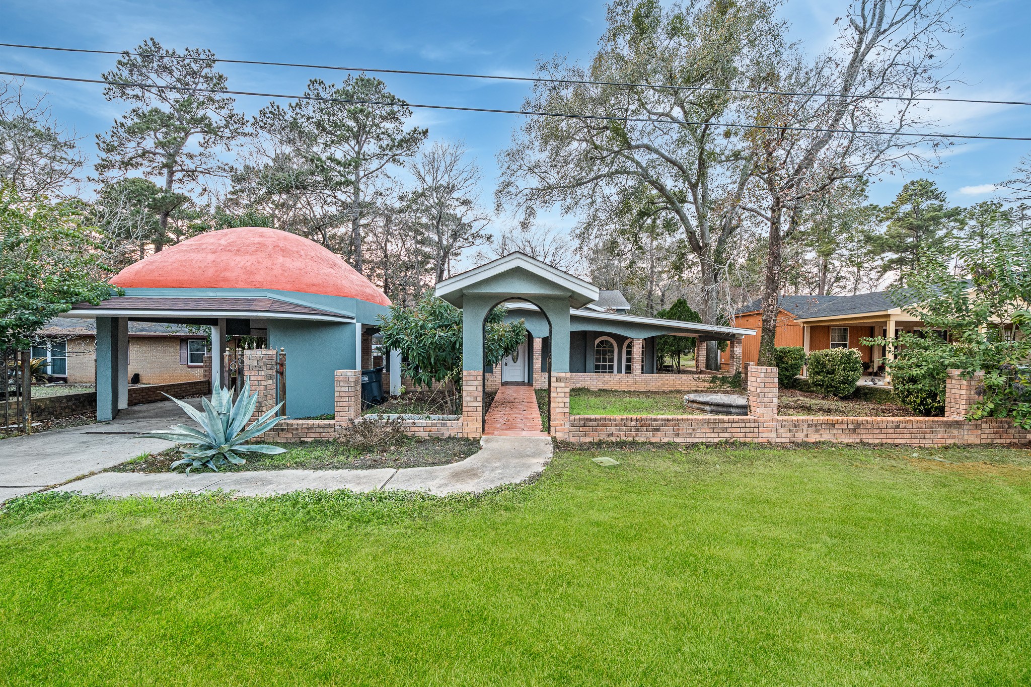 a front view of house with yard and outdoor seating