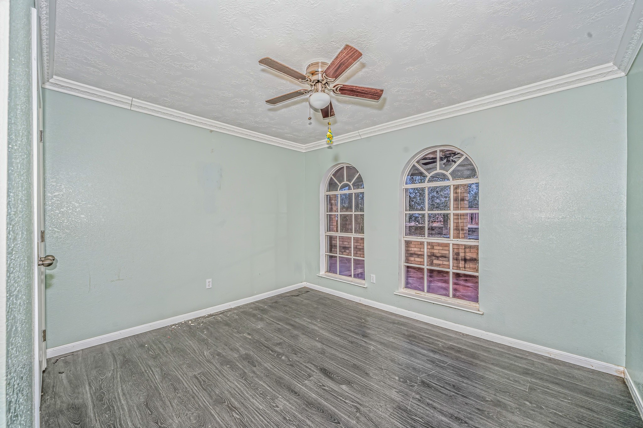 4771 Teas Court Conroe, TX 77304 - Photo 17 of 37 an empty room with windows and fan