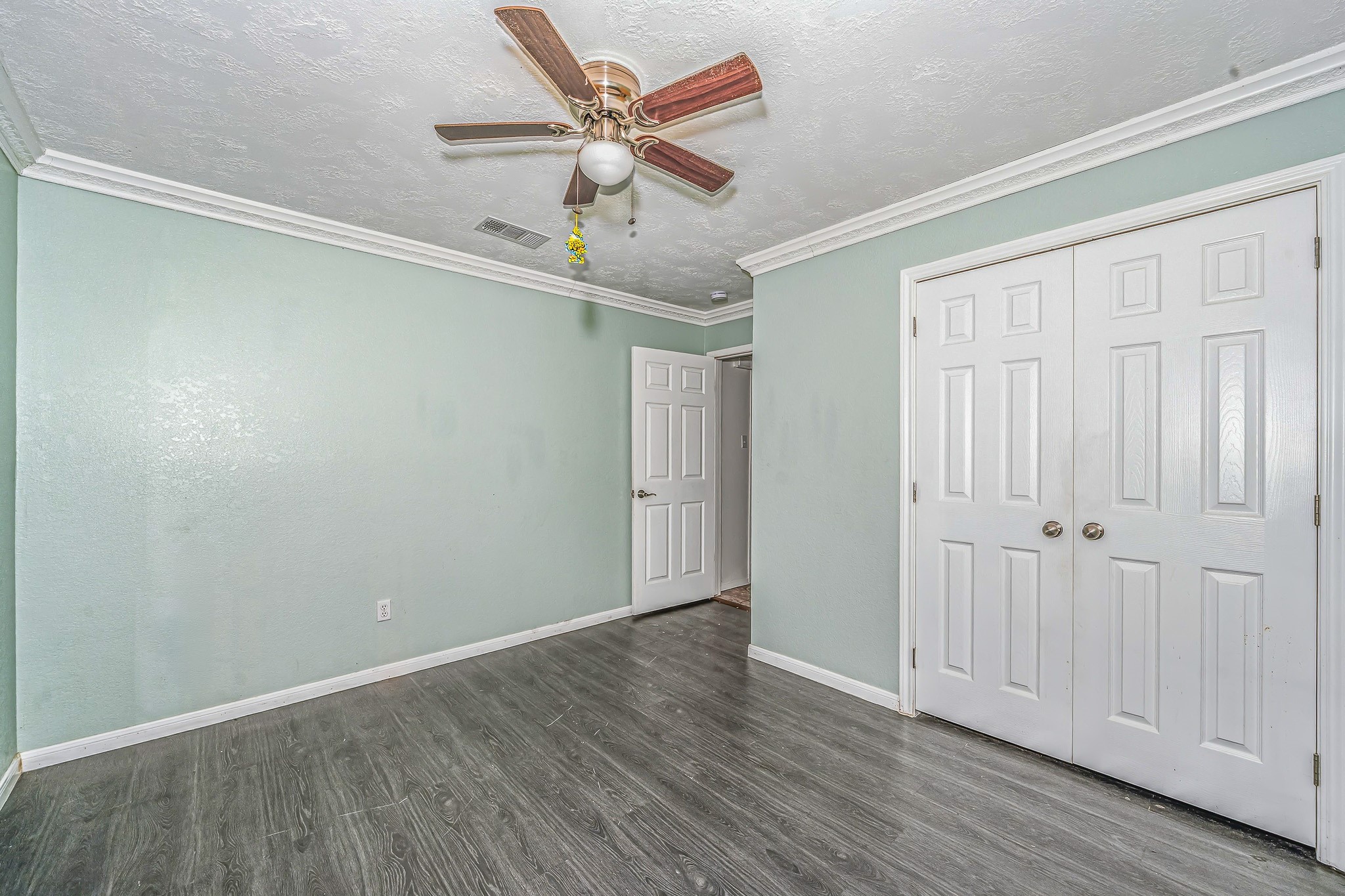 4771 Teas Court Conroe, TX 77304 - Photo 18 of 37 a view of an empty room with wooden floor