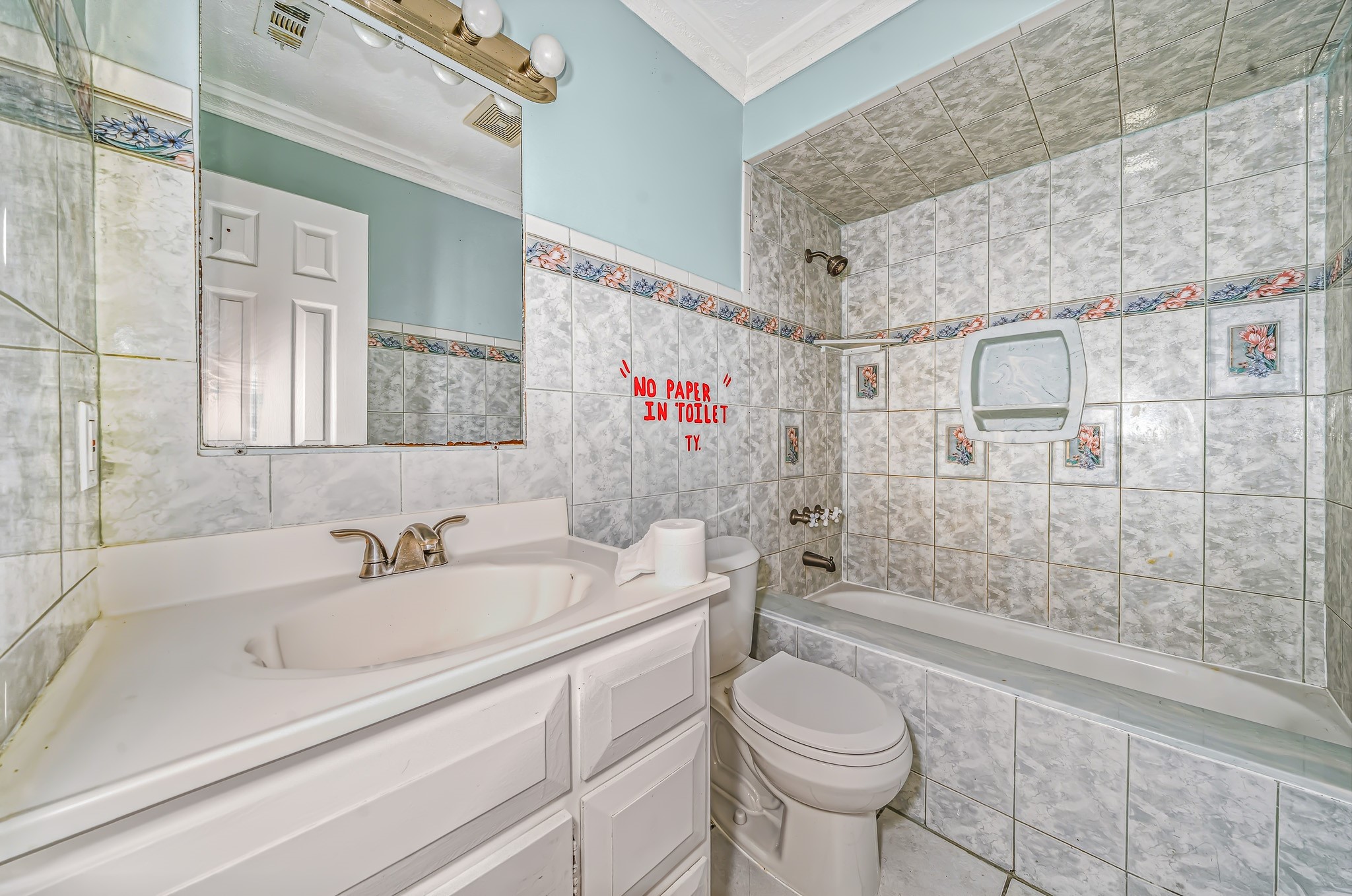 4771 Teas Court Conroe, TX 77304 - Photo 19 of 37 a bathroom with a sink a toilet and shower