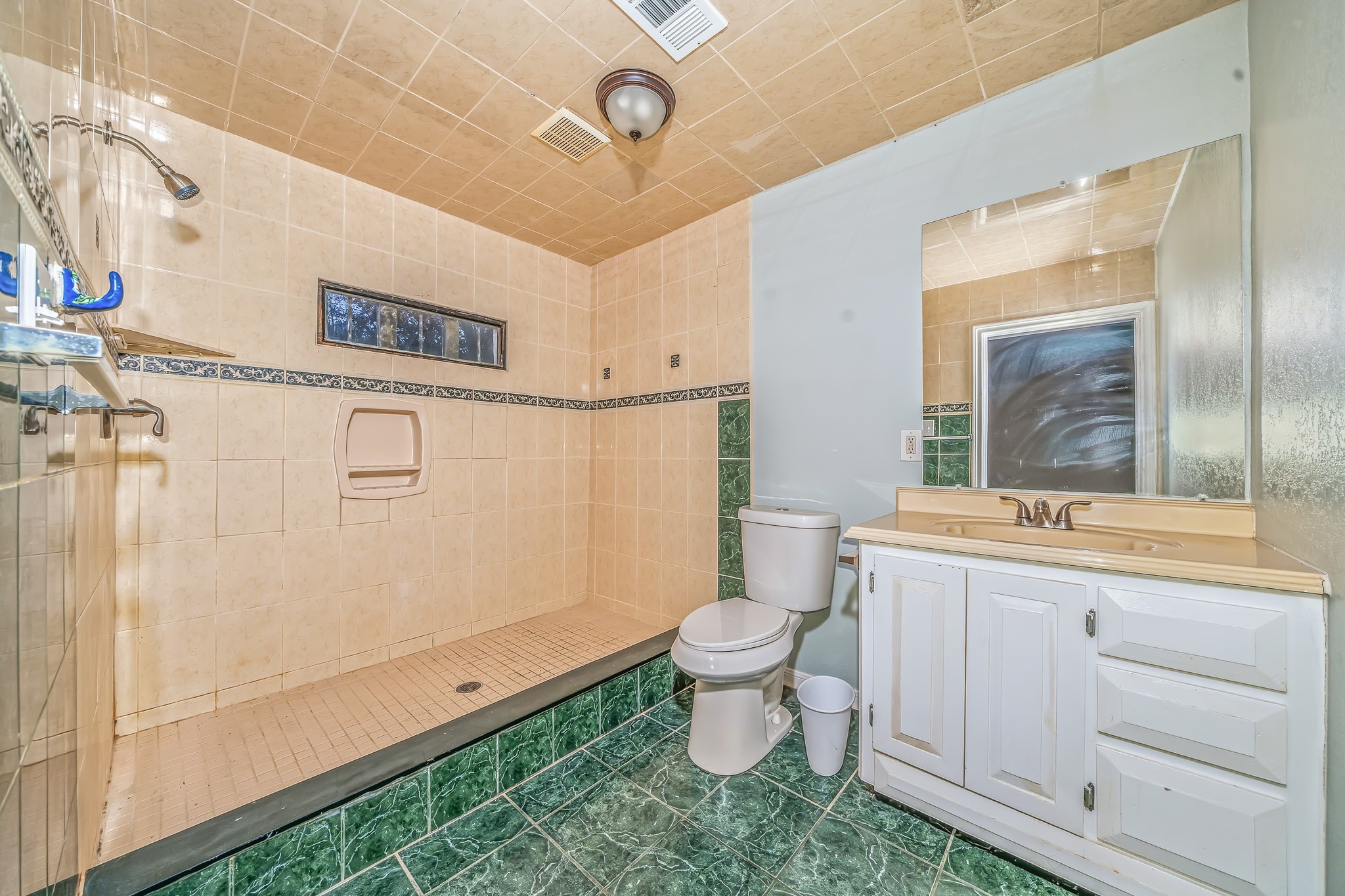 4771 Teas Court Conroe, TX 77304 - Photo 24 of 37 a bathroom with a toilet sink and mirror