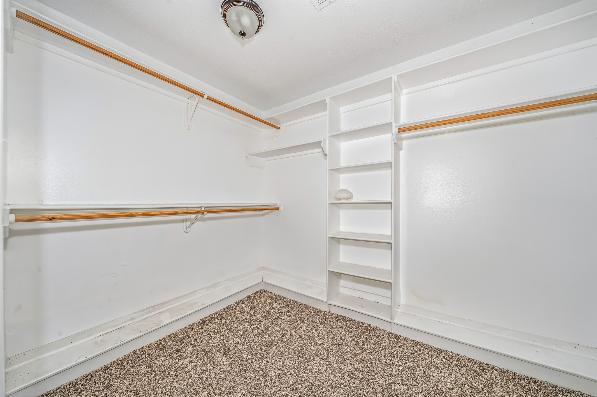 4771 Teas Court Conroe, TX 77304 - Photo 25 of 37 a view of an empty walk in closet