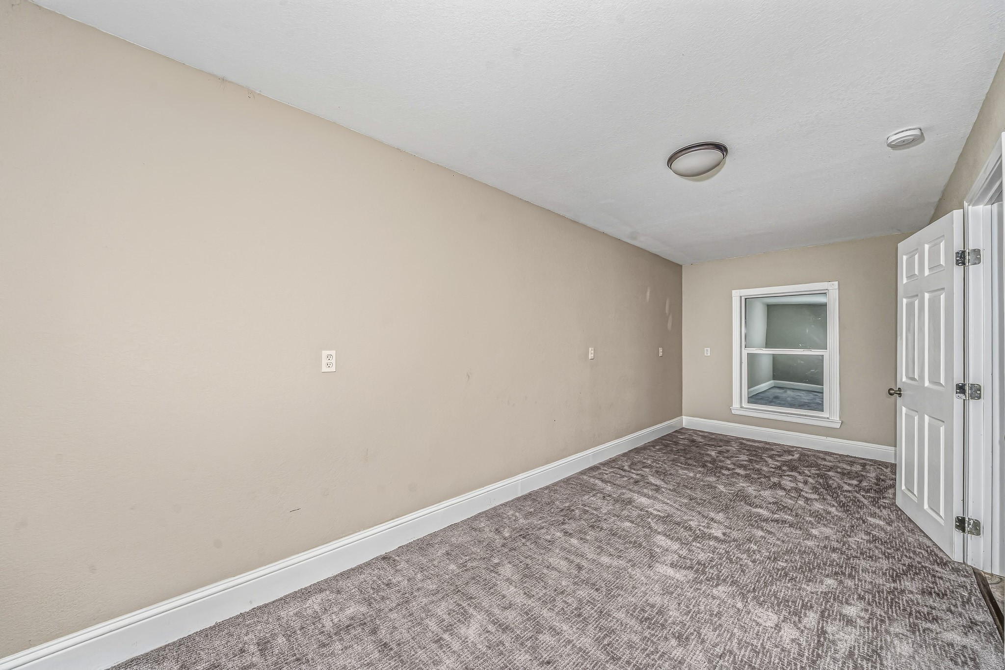 4771 Teas Court Conroe, TX 77304 - Photo 34 of 37 an empty room with a empty space and window