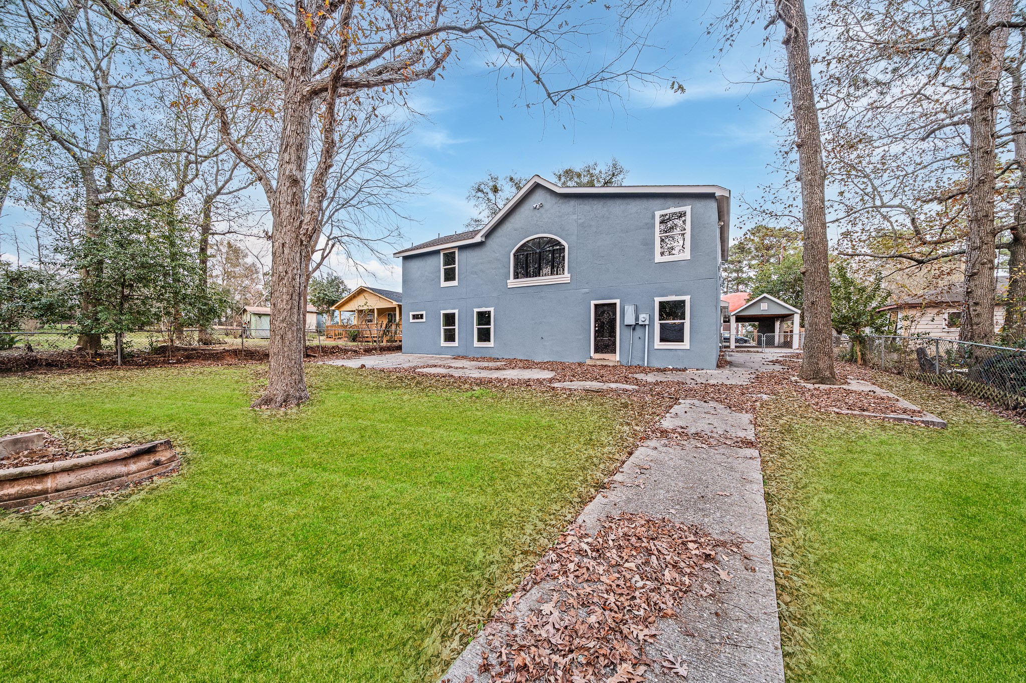 4771 Teas Court Conroe, TX 77304 - Photo 4 of 37 a front view of a house with garden and trees