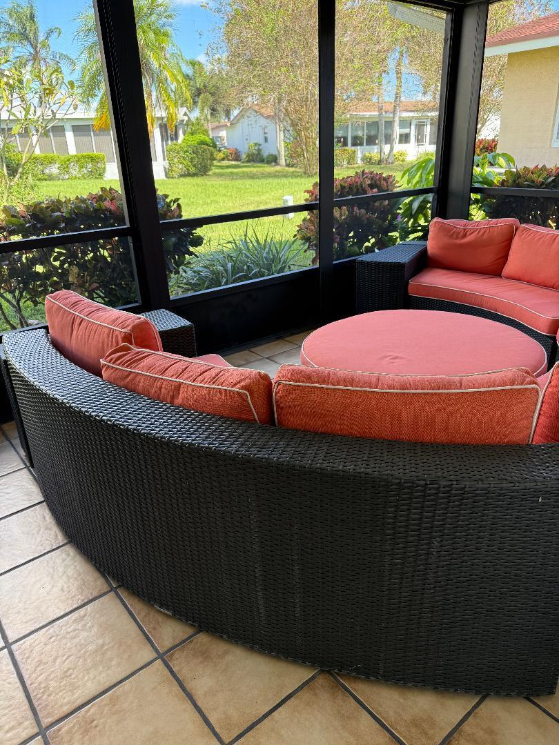 6217 Stanley Lane Delray Beach, FL 33484 - Photo 21 of 26 a bed sitting in a balcony next to a yard