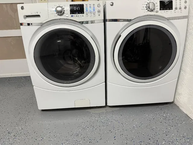 a utility room with dryer and washer