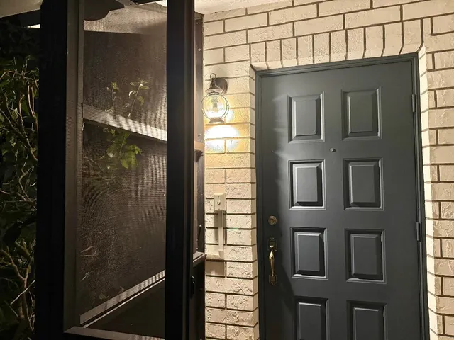 a view of a glass door of the house