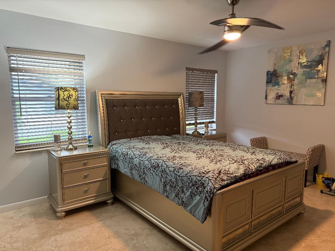 6217 Stanley Lane Delray Beach, FL 33484 - Photo 9 of 26 a bedroom with a bed and window