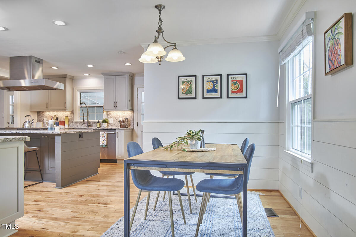 1502 Cassandra Drive Durham, NC 27712 - Photo 14 of 52 a view of a dining room with furniture and chandelier