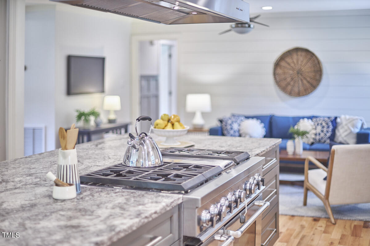 1502 Cassandra Drive Durham, NC 27712 - Photo 19 of 52 a living room with a table and chairs