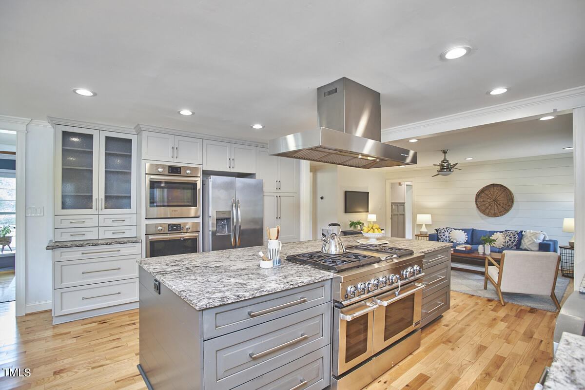 1502 Cassandra Drive Durham, NC 27712 - Photo 20 of 52 a kitchen with a stove and a refrigerator