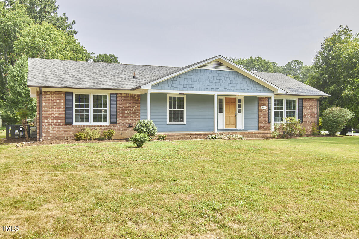1502 Cassandra Drive Durham, NC 27712 - Photo 2 of 52 a view of a house with pool and yard