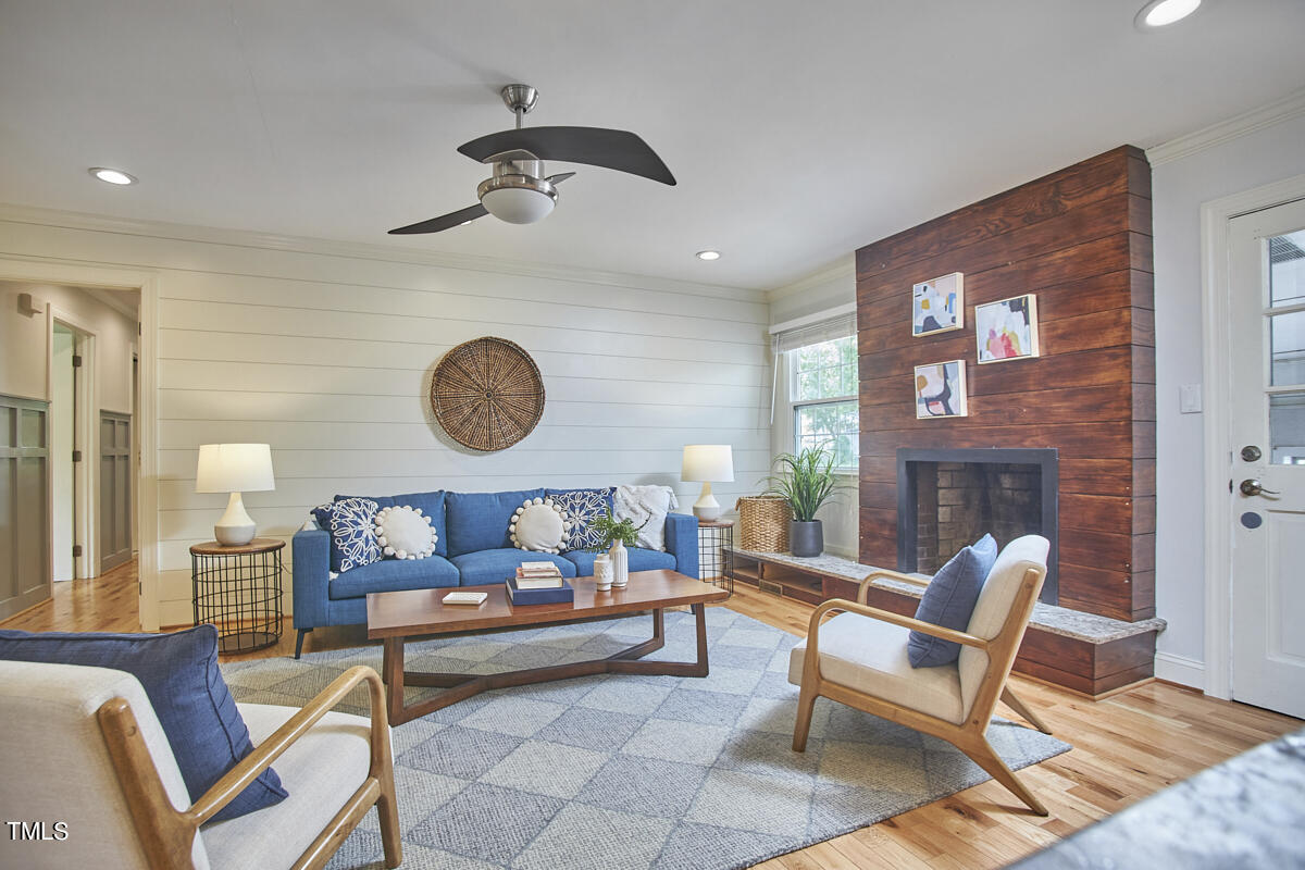 1502 Cassandra Drive Durham, NC 27712 - Photo 26 of 52 a living room with furniture and a table