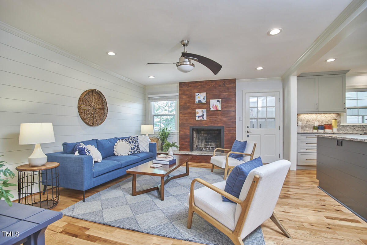 1502 Cassandra Drive Durham, NC 27712 - Photo 29 of 52 a living room with furniture a rug and a large window