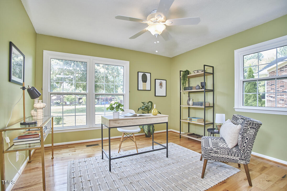 1502 Cassandra Drive Durham, NC 27712 - Photo 31 of 52 a living room with furniture and a window