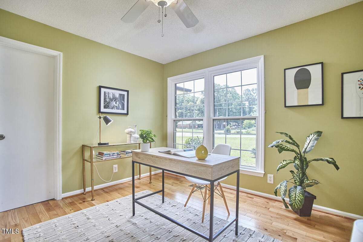 1502 Cassandra Drive Durham, NC 27712 - Photo 32 of 52 a workspace with furniture and a window