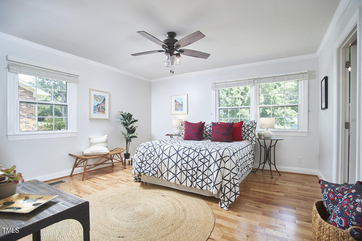 1502 Cassandra Drive Durham, NC 27712 - Photo 34 of 52 a living room with a bed furniture and a window