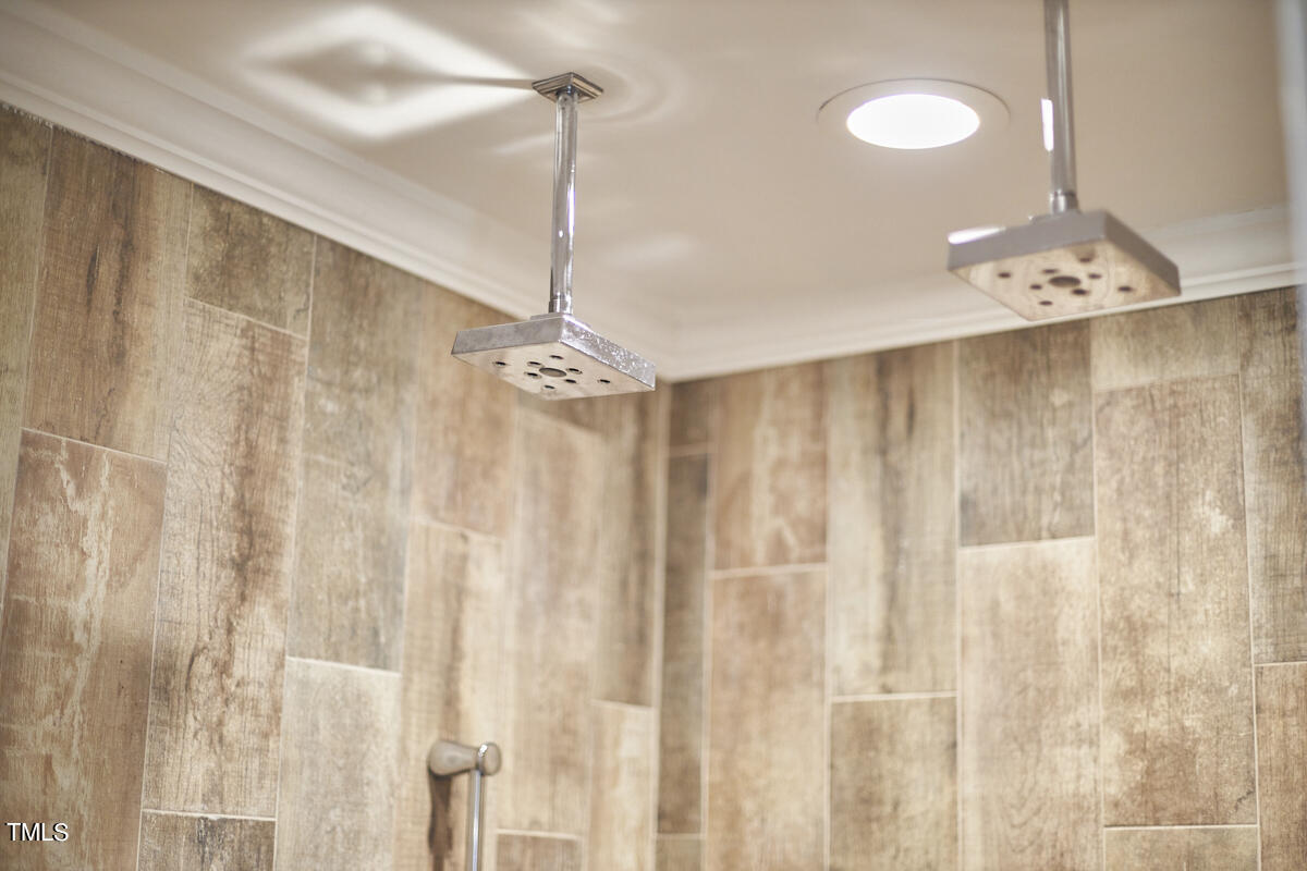 1502 Cassandra Drive Durham, NC 27712 - Photo 40 of 52 a view of a chandelier fan and wooden floor