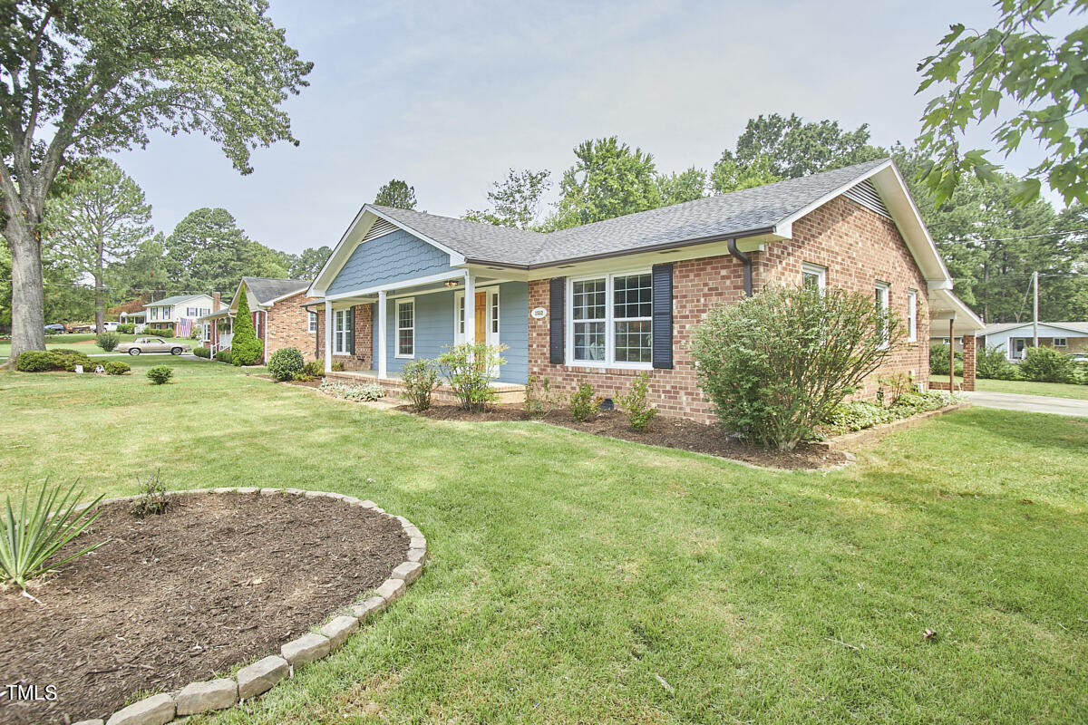 1502 Cassandra Drive Durham, NC 27712 - Photo 4 of 52 a front view of house with yard and green space