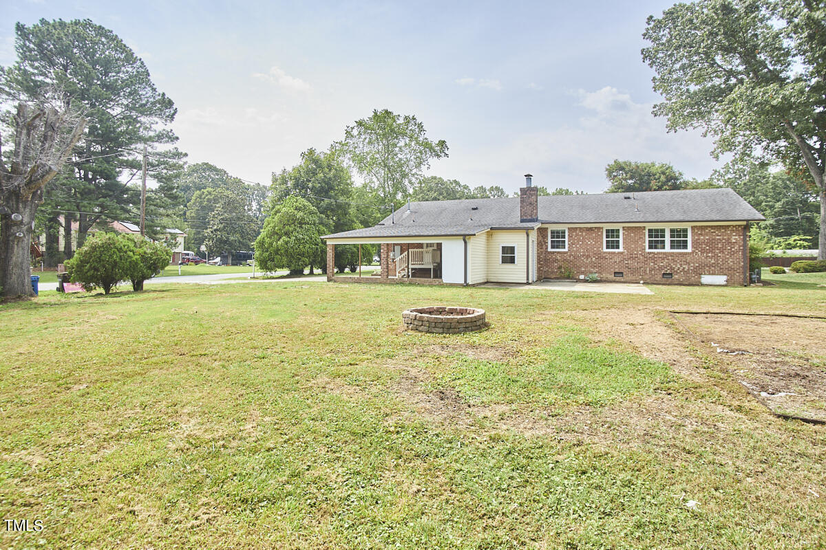 1502 Cassandra Drive Durham, NC 27712 - Photo 49 of 52 a front view of a house with yard and green space