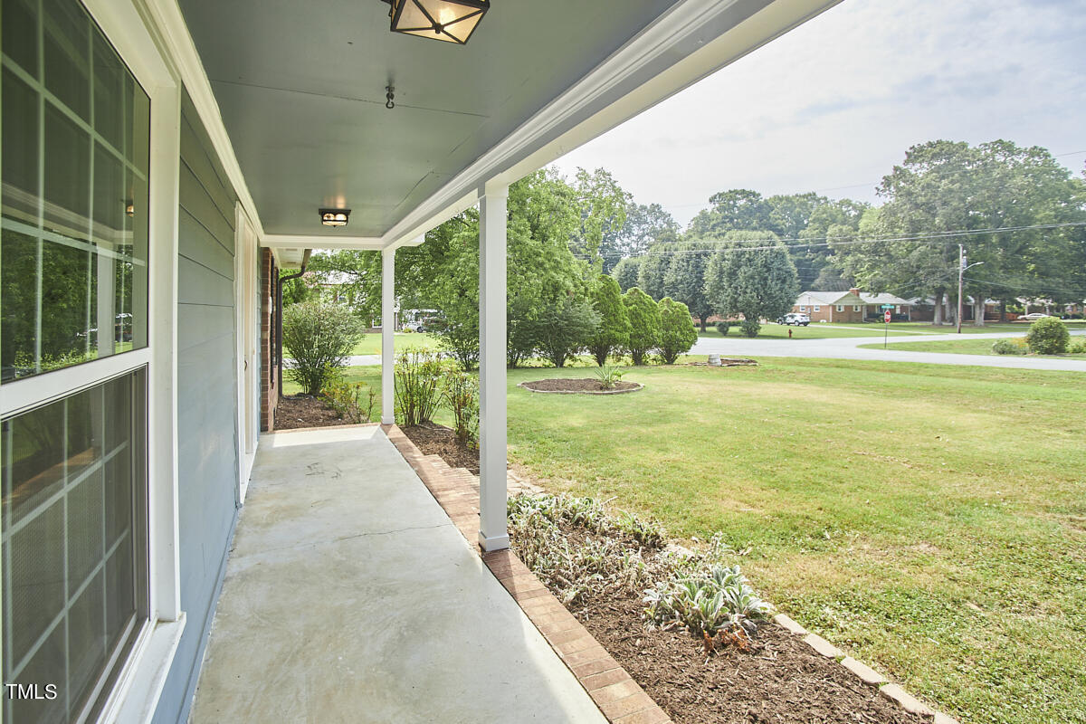 1502 Cassandra Drive Durham, NC 27712 - Photo 6 of 52 a view of a porch with a big yard