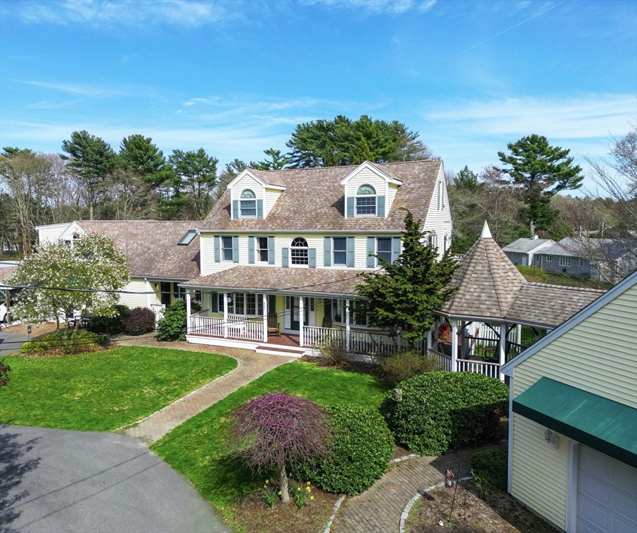 an aerial view of a house with garden view