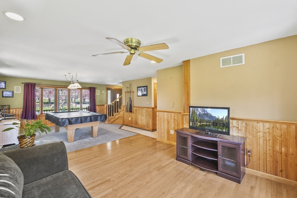 325 Mendall Road Acushnet, MA 02743 - Photo 11 of 42 a living room with furniture and a flat screen tv