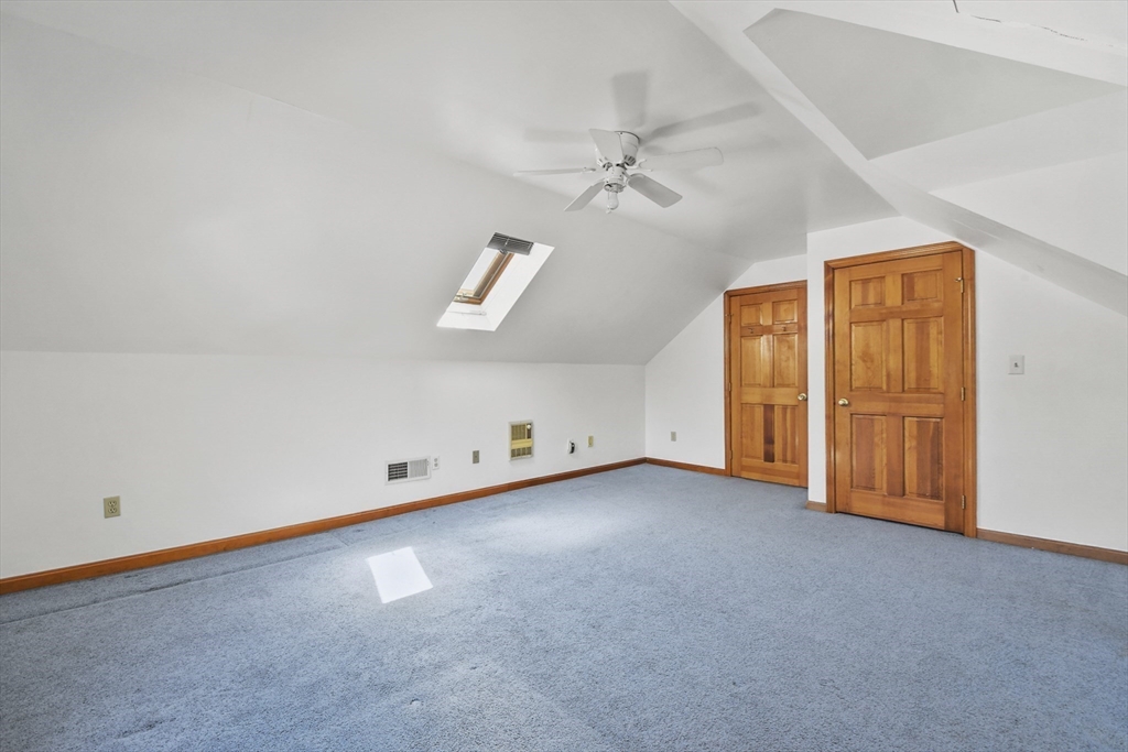 325 Mendall Road Acushnet, MA 02743 - Photo 25 of 42 an empty room with windows and fan