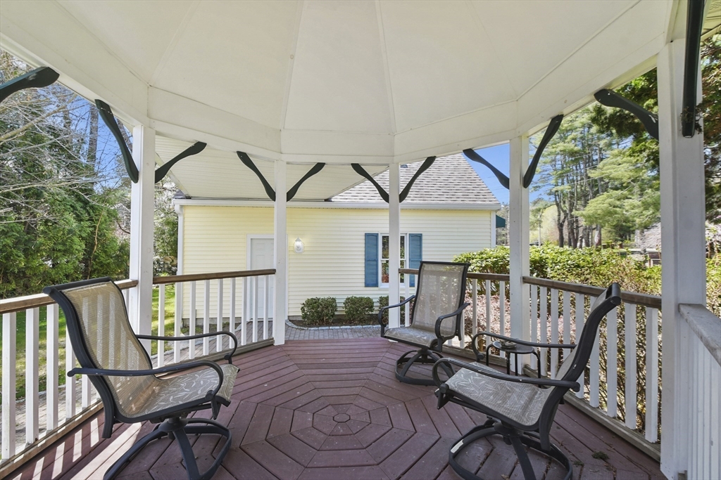 325 Mendall Road Acushnet, MA 02743 - Photo 37 of 42 a view of a patio with a table chairs and a yard