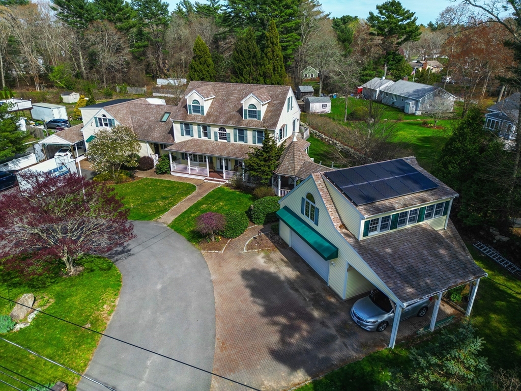 325 Mendall Road Acushnet, MA 02743 - Photo 41 of 42 a aerial view of a house with a yard table and chairs
