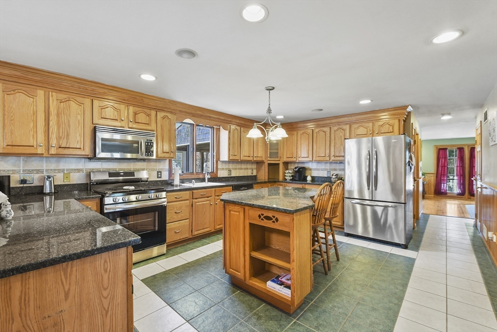 325 Mendall Road Acushnet, MA 02743 - Photo 7 of 42 a kitchen with stainless steel appliances granite countertop a stove refrigerator sink and dishwasher