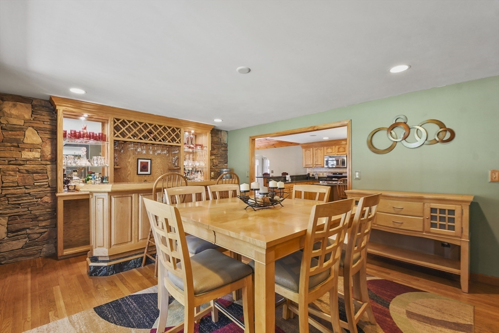 325 Mendall Road Acushnet, MA 02743 - Photo 9 of 42 a view of a dining room with furniture and wooden floor