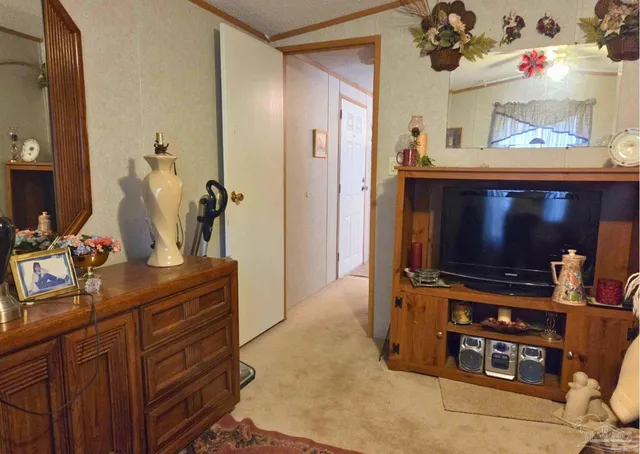 a room with furniture and flat screen tv