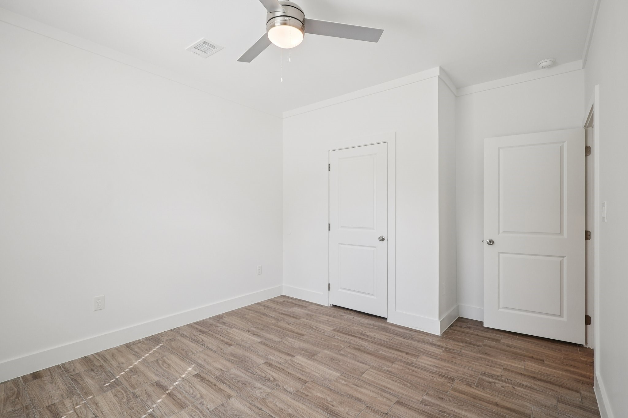 3917 Sayers Street Houston, TX 77026 - Photo 18 of 26 a view of an empty room with wooden floor