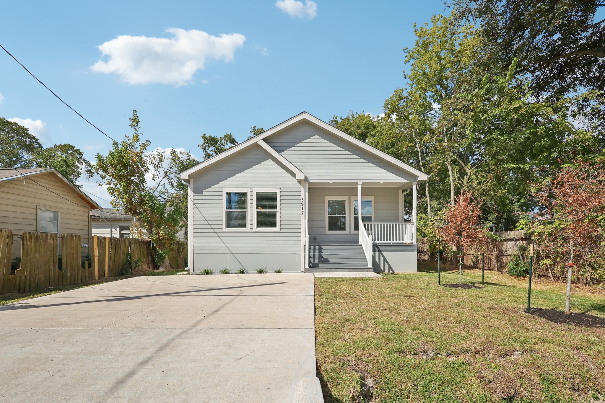 3917 Sayers Street Houston, TX 77026 - Photo 2 of 26 a front view of a house with a yard and garage