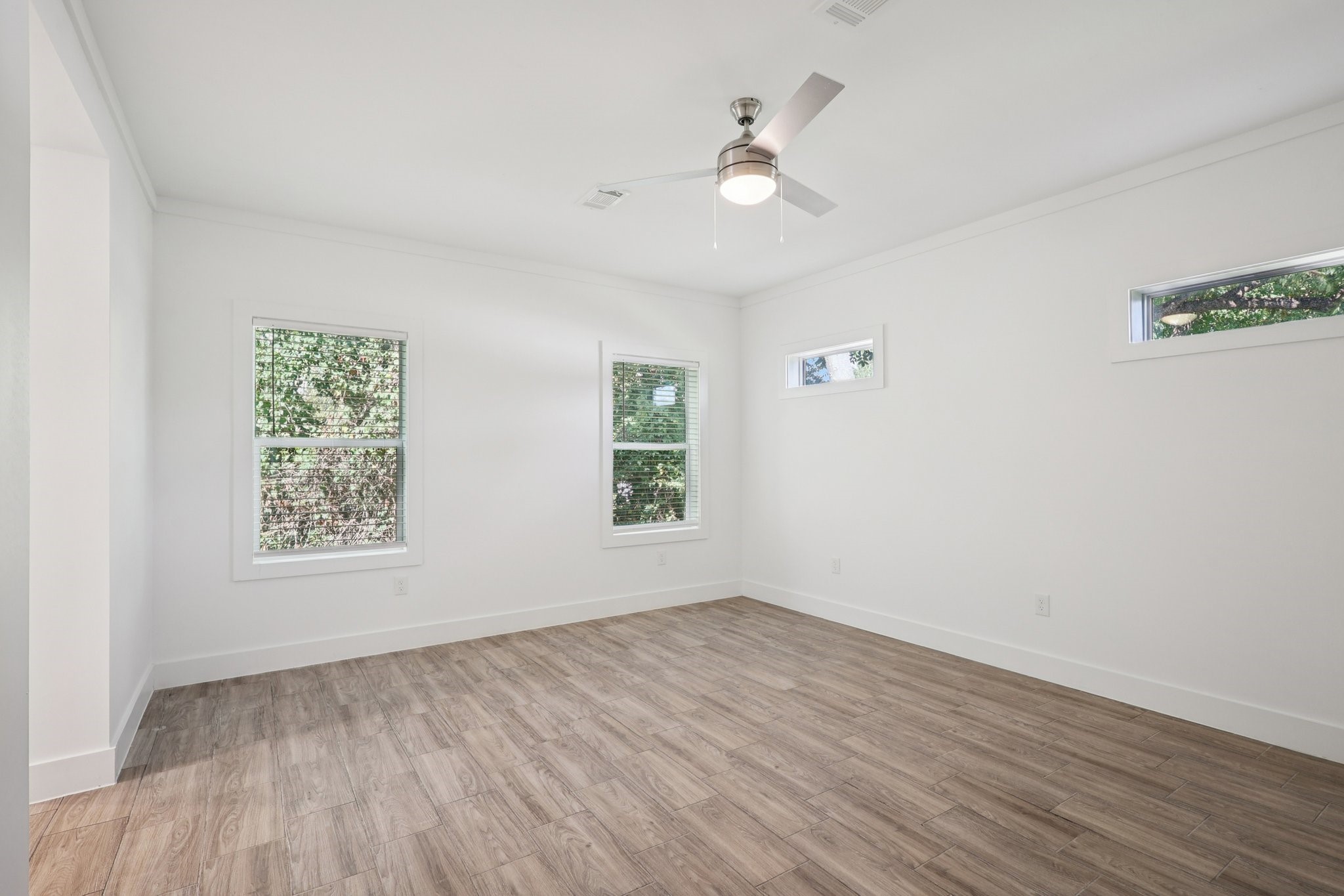 3917 Sayers Street Houston, TX 77026 - Photo 21 of 26 wooden floor in an empty room with a window